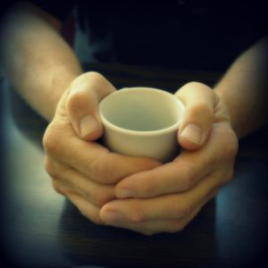 Fingers and mug